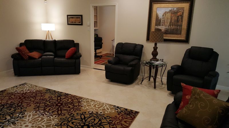 Living room with a sofa and two chairs